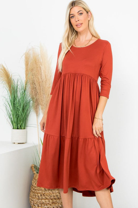 A Joy Forever Tiered Midi Dress in Rust